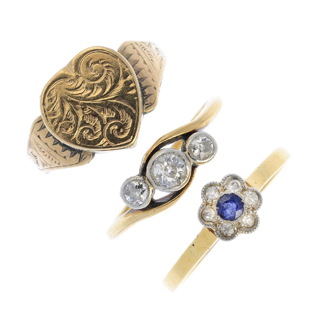 Four rings. To include a diamond three-stone ring, a (1 of 4)