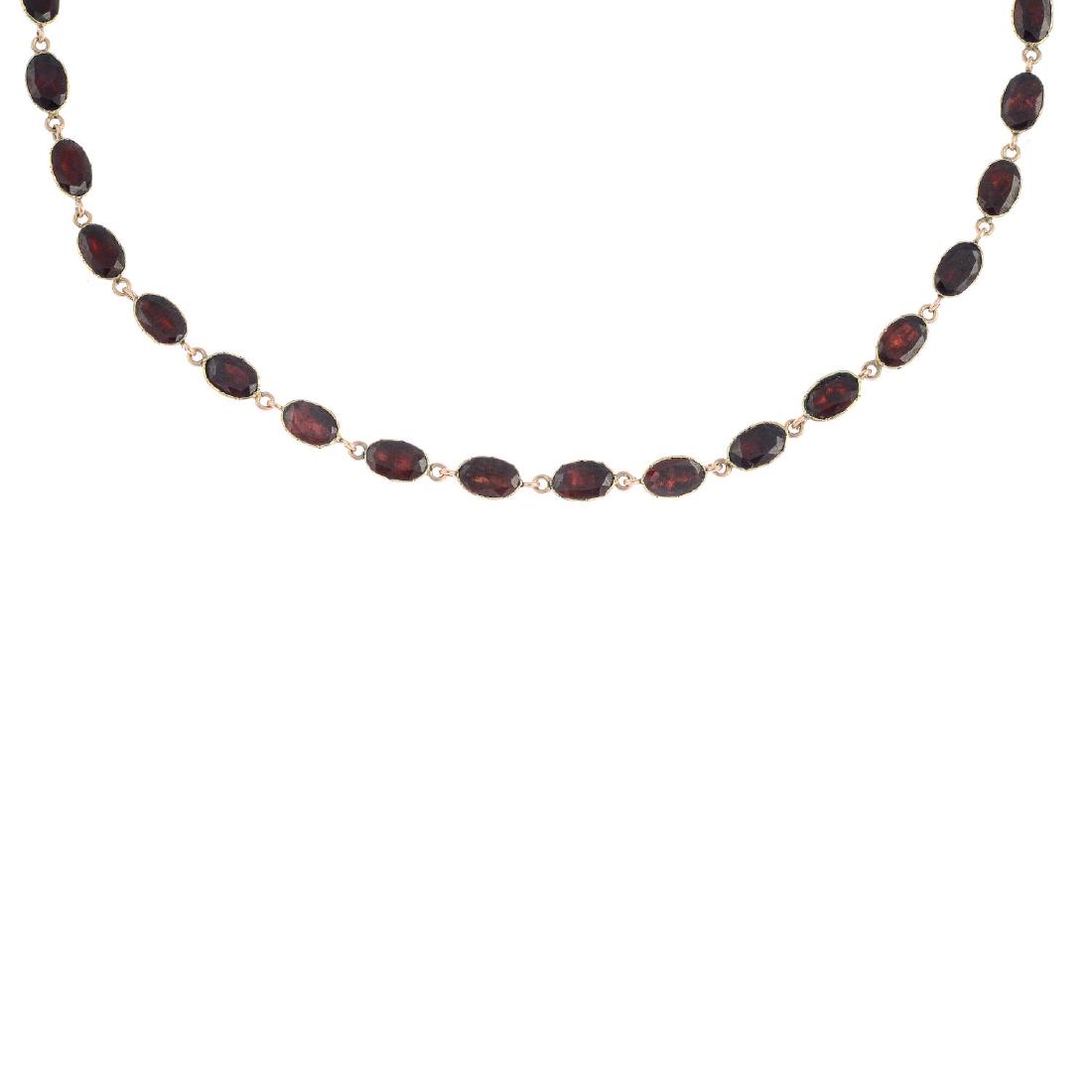 An early 19th century gold garnet necklace. Designed as (1 of 3)