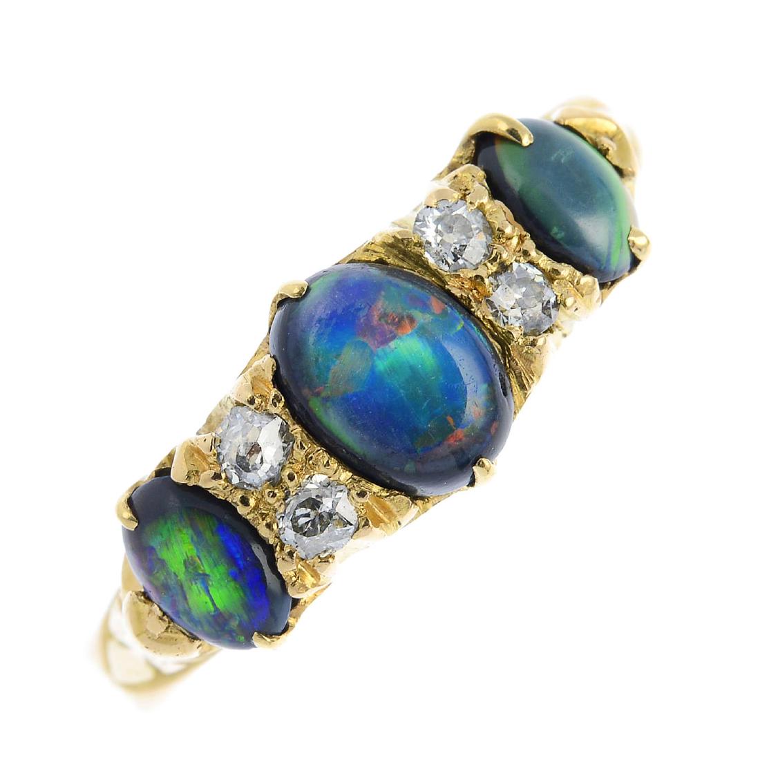 An opal three-stone and diamond ring. The graduated (1 of 3)