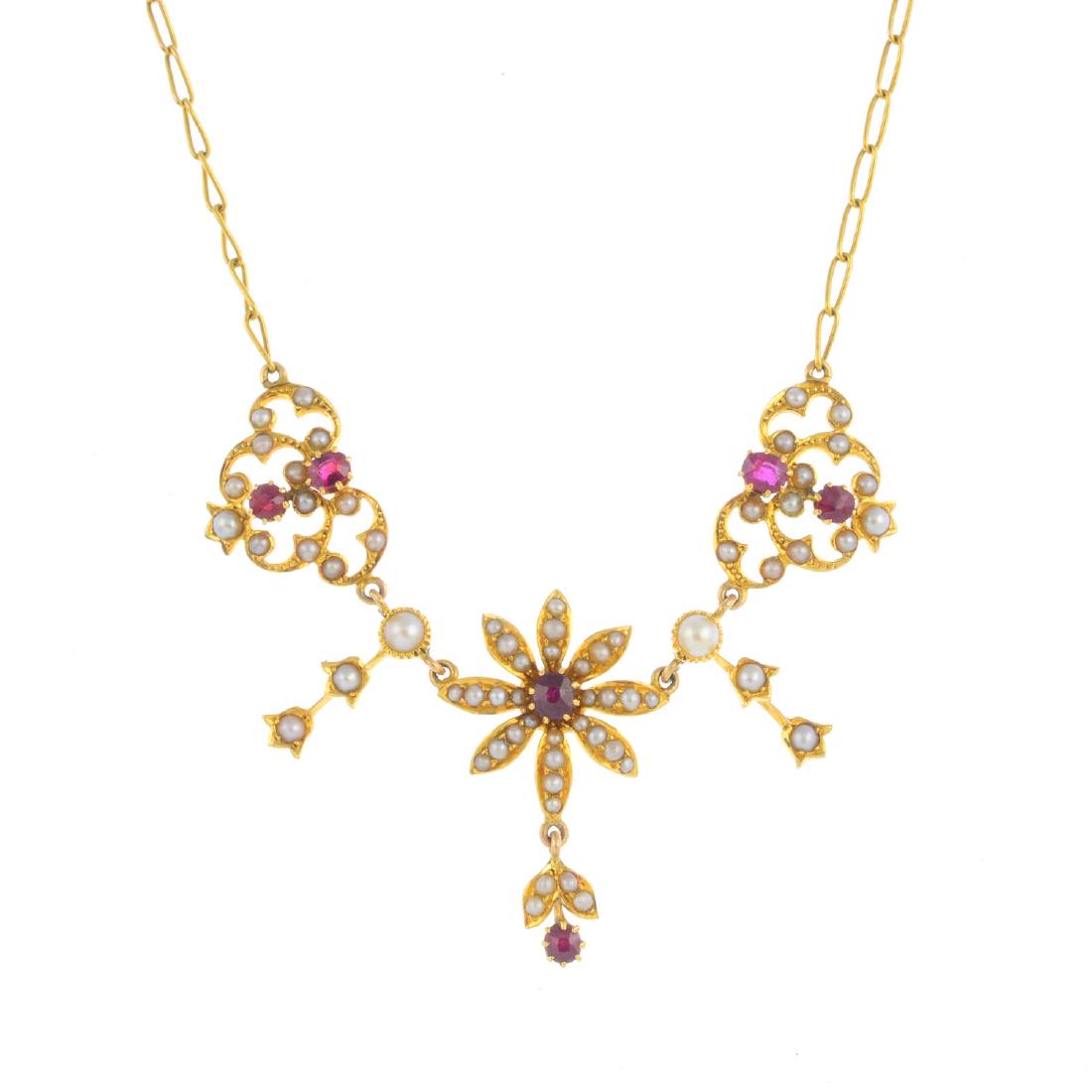 An early 20th century gold, ruby and split pearl floral (1 of 3)