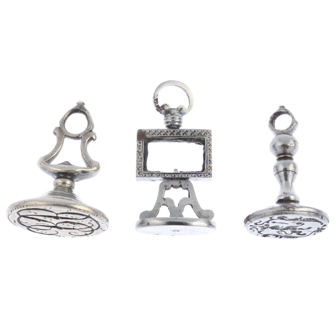 Six Georgian and later seals. To include a carnelian: Six Georgian and later seals. To include a carnelian seal with monogrammed shield, two crest seals, together with three further seals in silver and steel. Lengths 2.9 to 3.4cms.