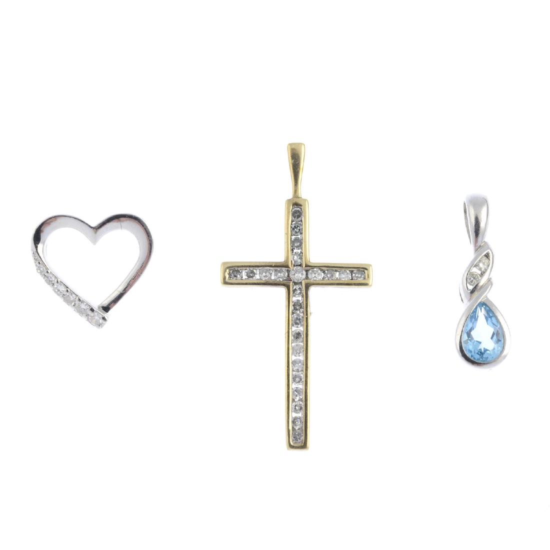 Three 9ct gold diamond and topaz pendants. To include a (1 of 2)