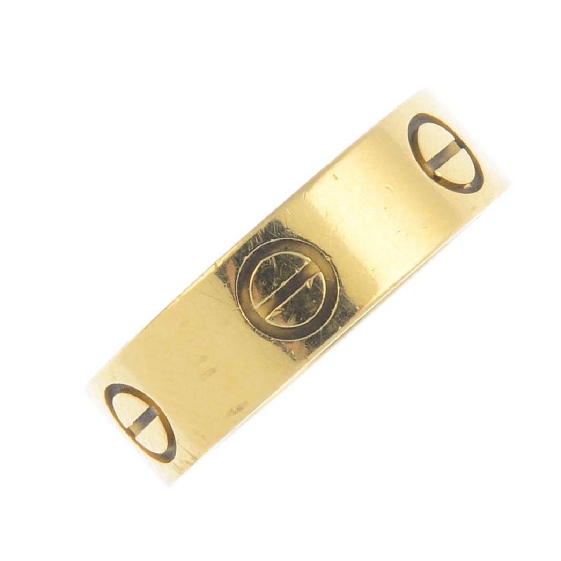 CARTIER - an 18ct gold 'Love' ring. The polished band, (1 of 3)