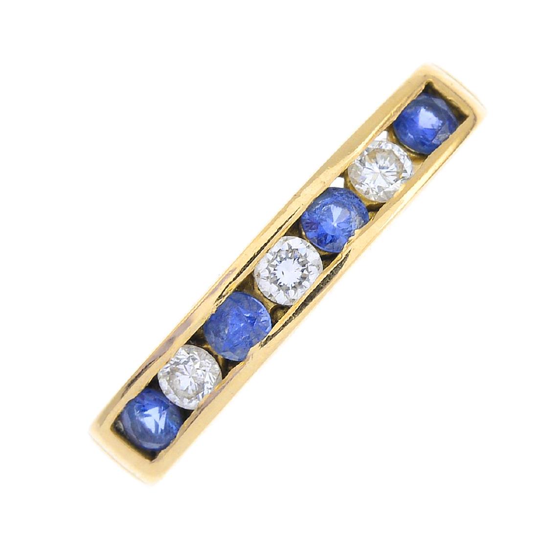 An 18ct gold diamond and sapphire half eternity ring. (1 of 3)