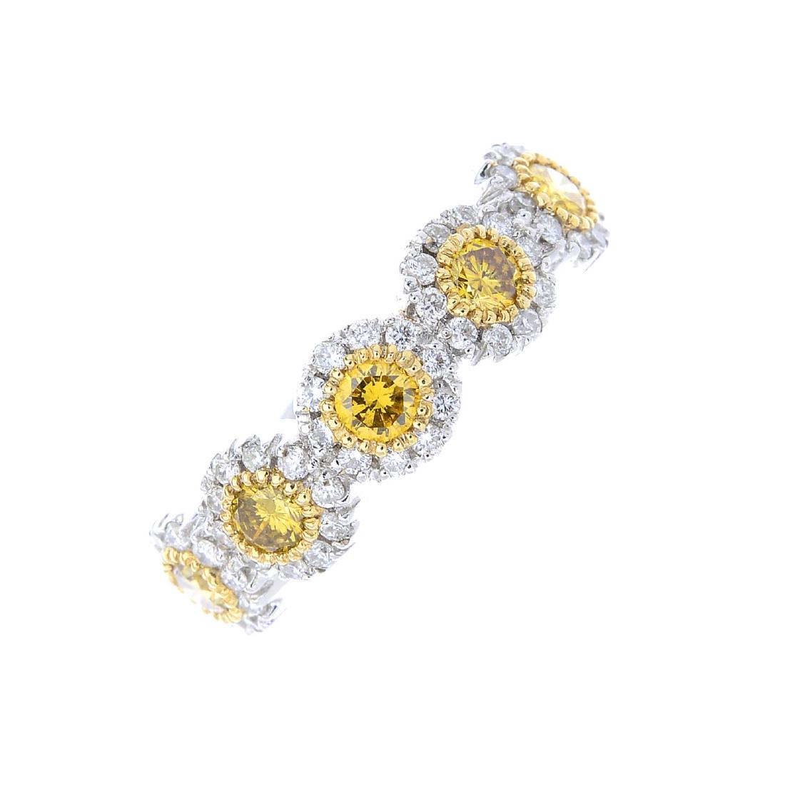 An 18ct gold coloured diamond and diamond ring. The (1 of 3)