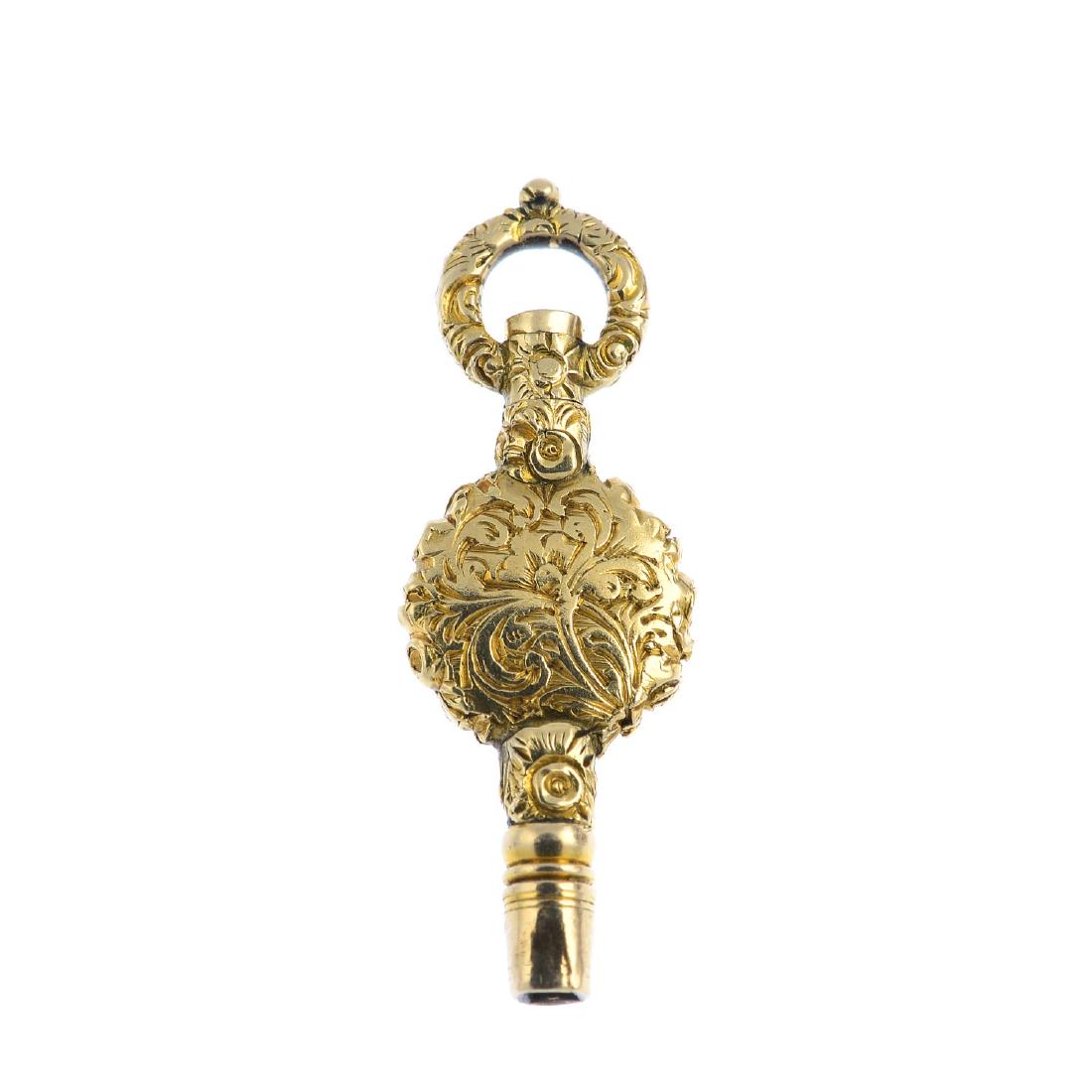 A mid Victorian 12ct gold watch key. With scrolling (1 of 2)