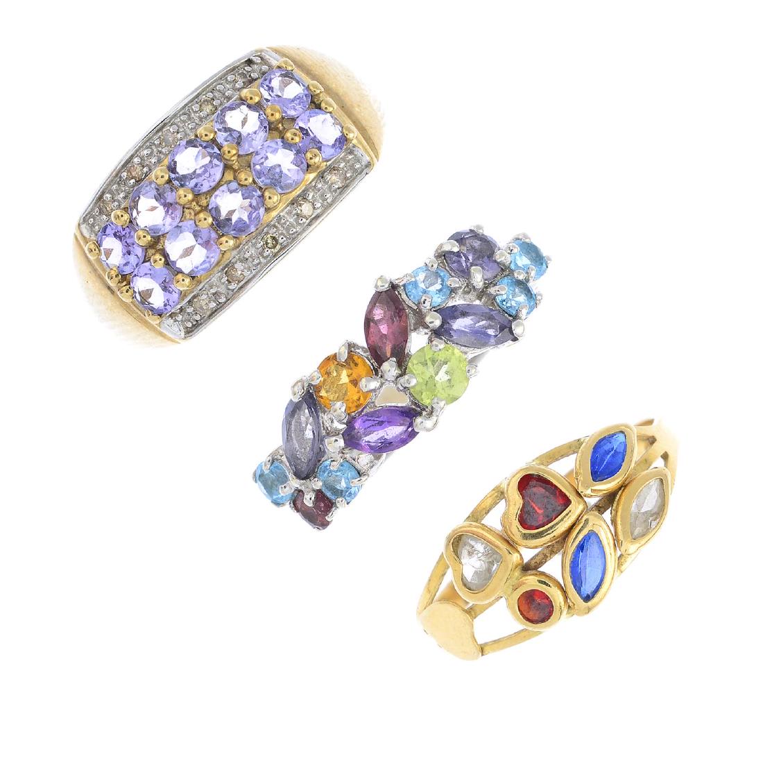 Four gem-set dress rings. To include a 9ct gold (1 of 3)