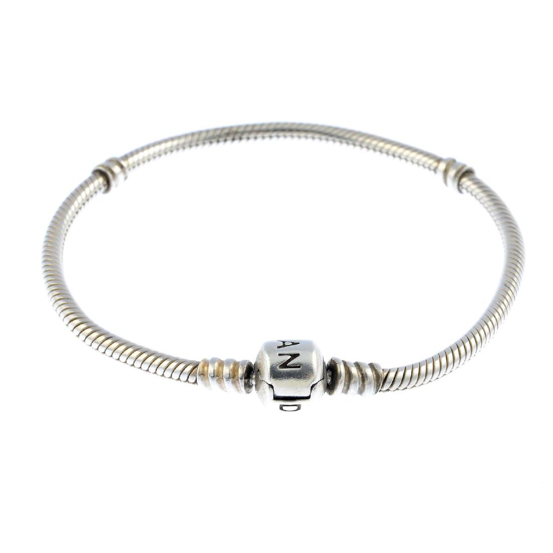 PANDORA - a selection of bracelets and charms. To: PANDORA - a selection of bracelets and charms. To include five snake-link bracelets, a multi-row bracelet, a plain bangle, with three charms. Maker's marks for Pandora. Length of bracelets 15 to 18cms