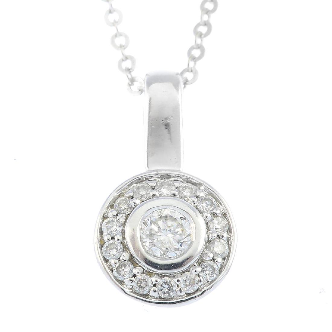 An 18ct gold diamond pendant. The brilliant-cut diamond (1 of 3)