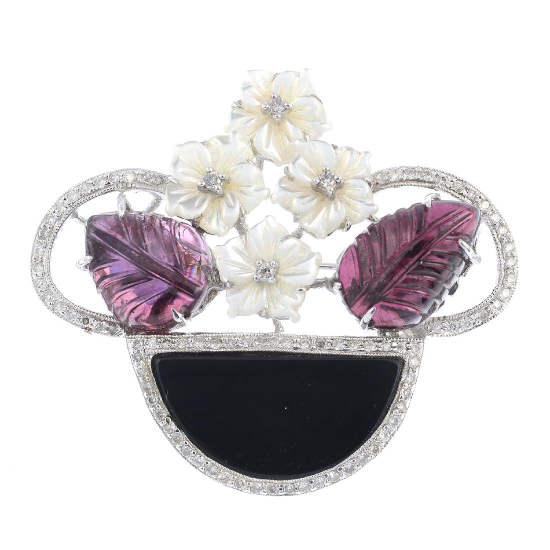 A diamond and gem-set brooch. Designed as a carved (1 of 2)