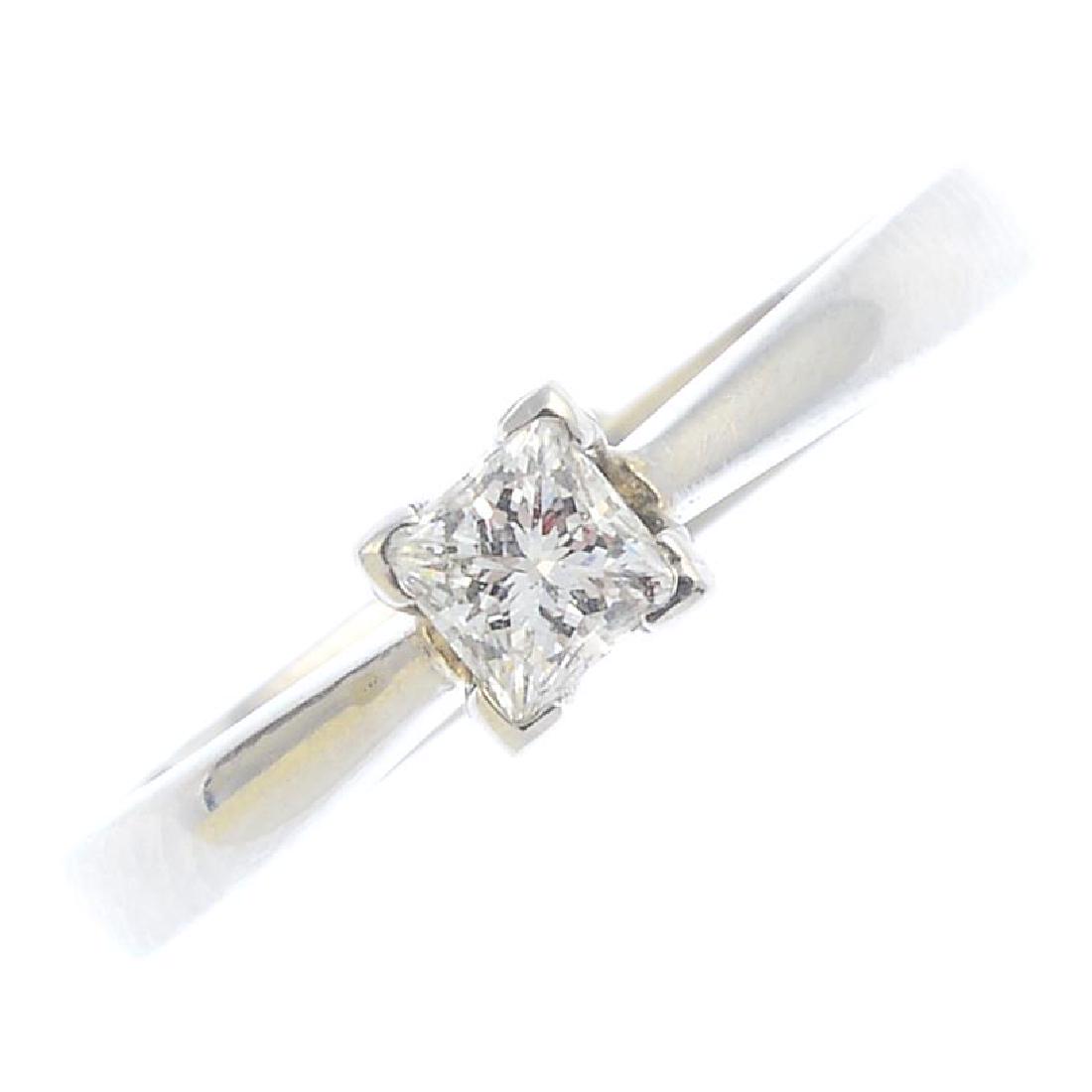 A diamond single-stone ring. The square-shape diamond, (1 of 3)