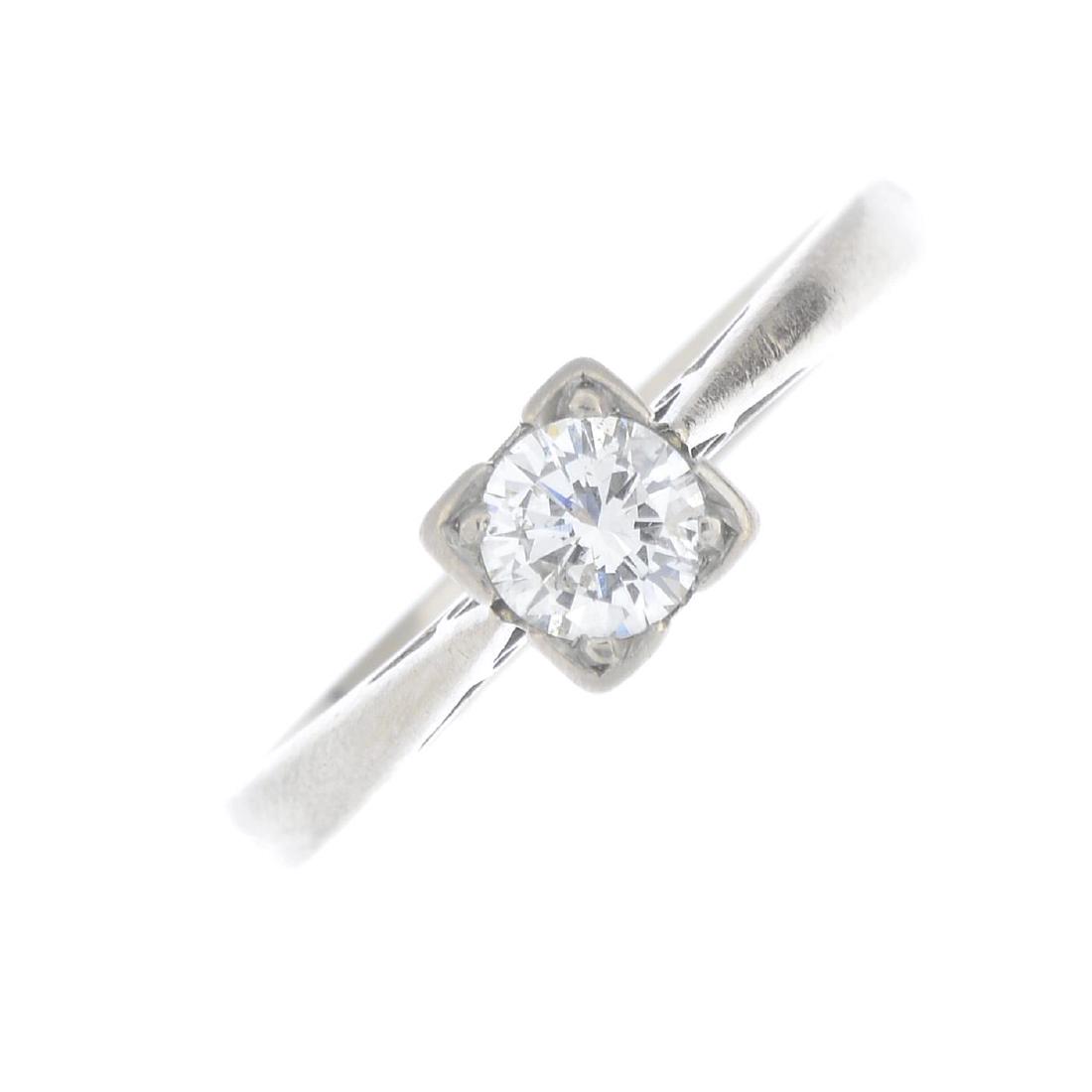 An 18ct gold diamond single-stone ring. The (1 of 3)