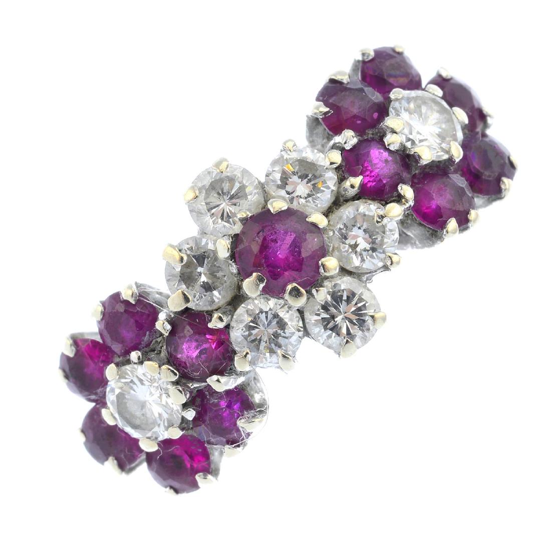 An 18ct gold ruby and diamond ring. Designed as three (1 of 3)