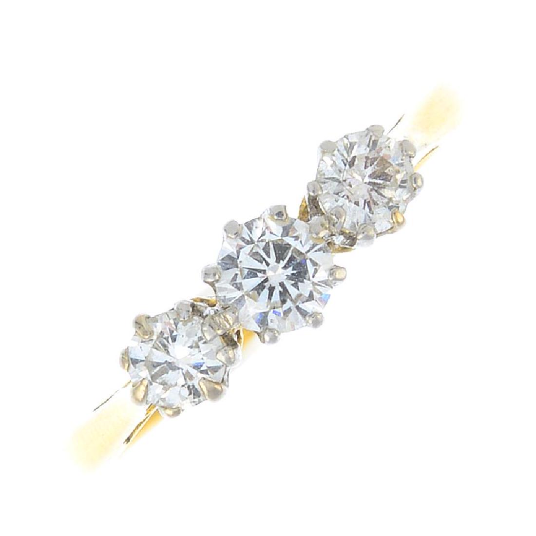 A diamond three-stone ring. The graduated brilliant-cut (1 of 4)