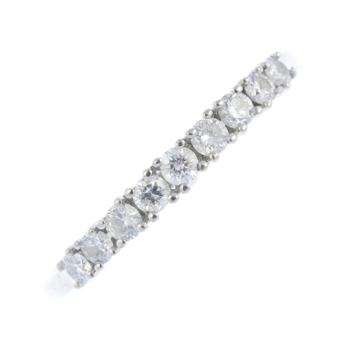 An 18ct gold diamond half eternity ring. Designed as a (1 of 3)