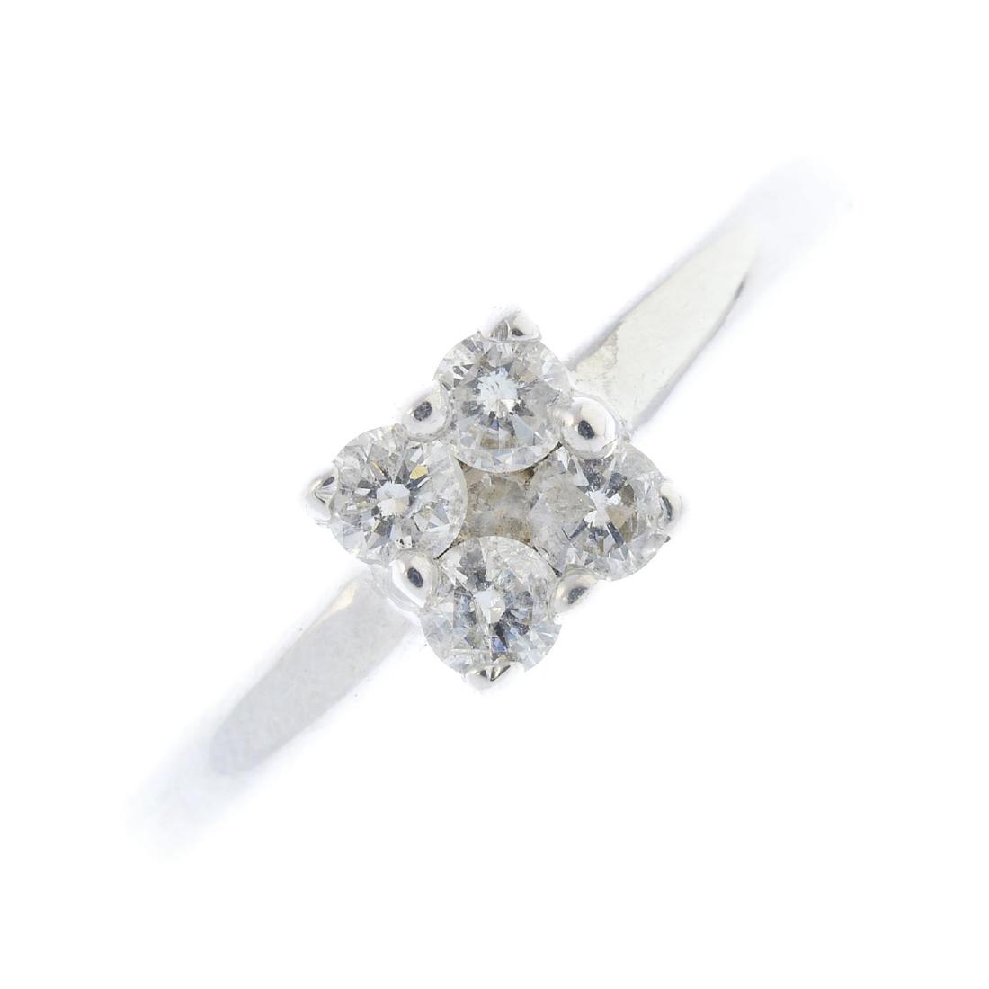 An 18ct gold diamond cluster ring. The brilliant-cut (1 of 3)
