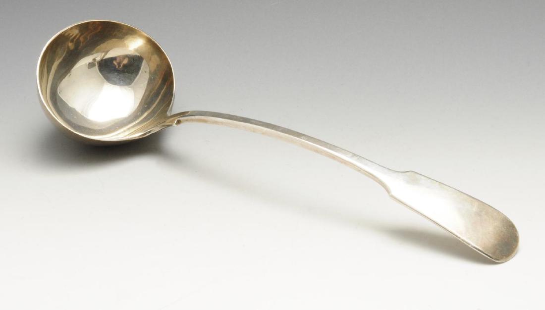 An Edwardian silver soup ladle in plain Fiddle pattern.: An Edwardian silver soup ladle in plain Fiddle pattern. Hallmarked Spink & Son (John Marshall Spink), London 1901. Length measuring 13 inches (33 cm), weight 10 ozt (311.5 grams).