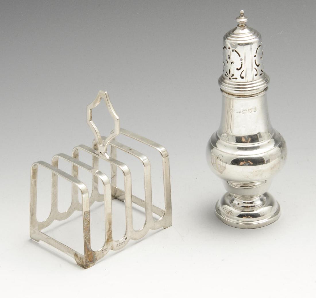 A small 1930's silver caster, of plain bellied form: A small 1930's silver caster, of plain bellied form with removable pierced cover with knopped finial and raised upon a circular stepped base, hallmarked S Blanckensee & Son Ltd., Chester 1935, maximum