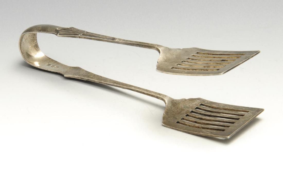 A pair of Edwardian silver sardine servers/tongs, of: A pair of Edwardian silver sardine servers/tongs, of Albany pattern with pierced blades and personal inscription to the terminal, hallmarked William Hutton & Sons Ltd., London 1908, length measuring 7