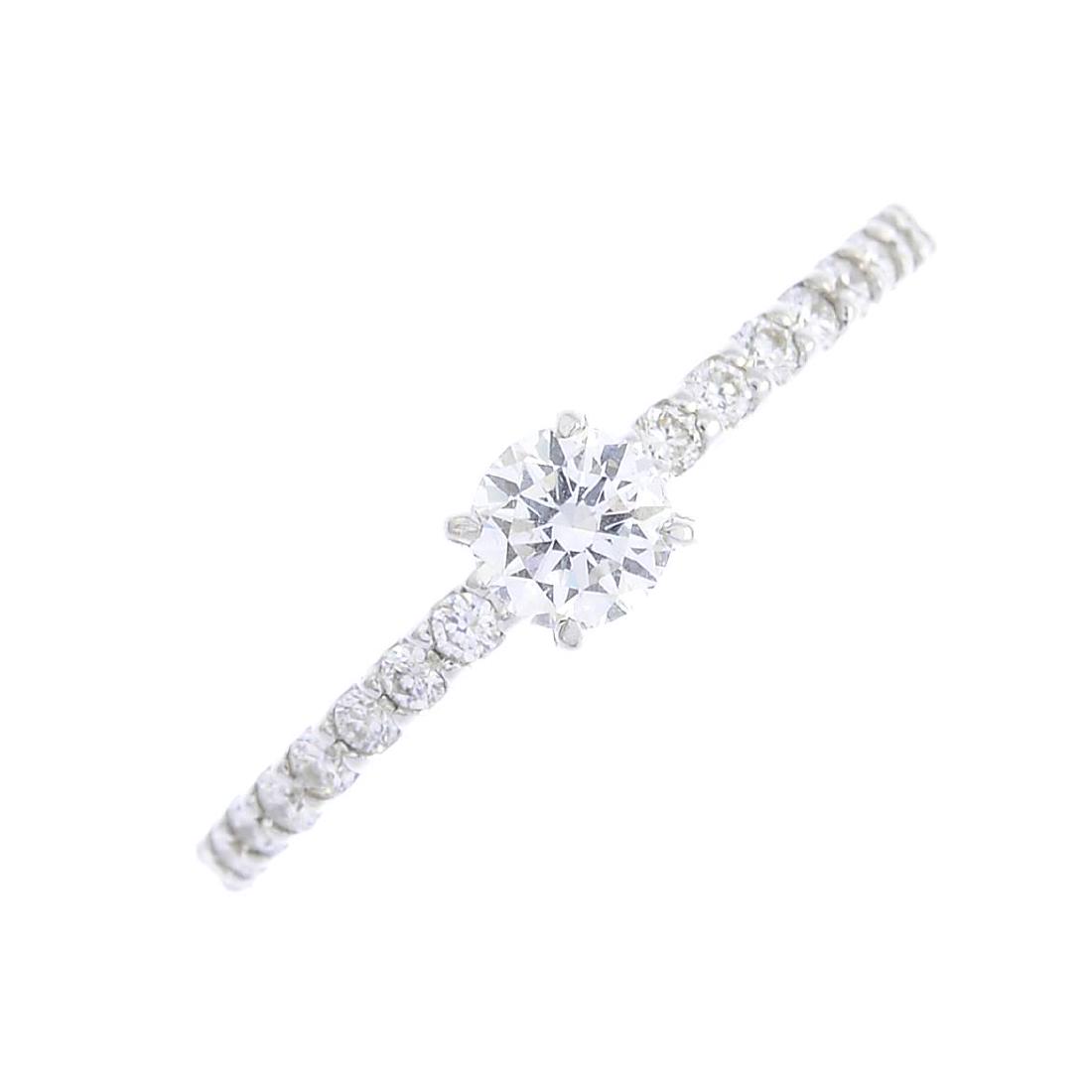 An 18ct gold diamond single-stone ring. The (1 of 3)