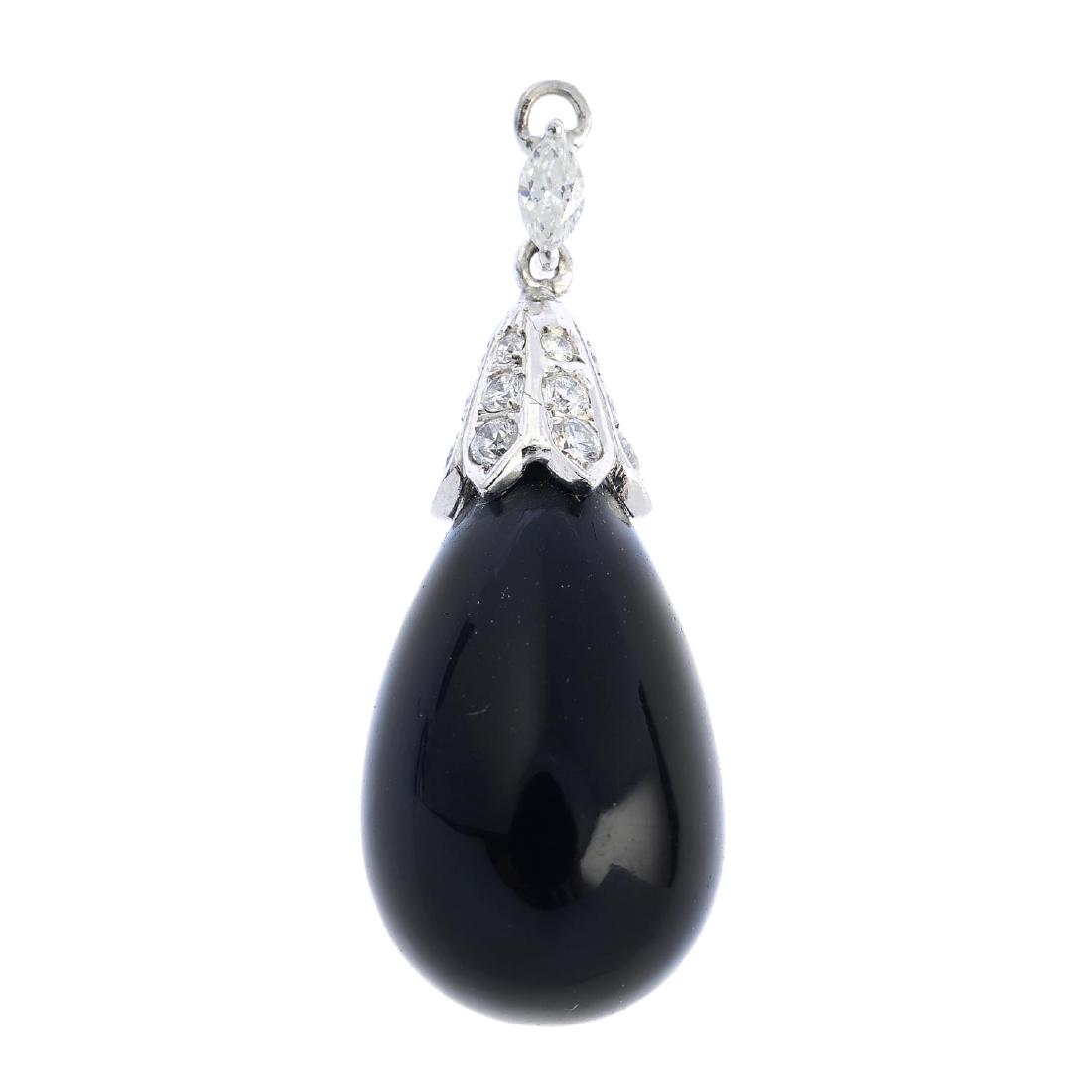 An onyx and diamond pendant. The pear-shape onyx drop, (1 of 2)