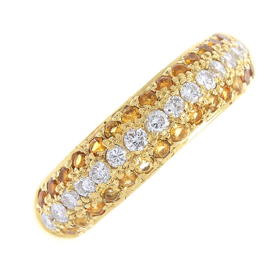 An 18ct gold diamond and citrine band ring. The (1 of 3)