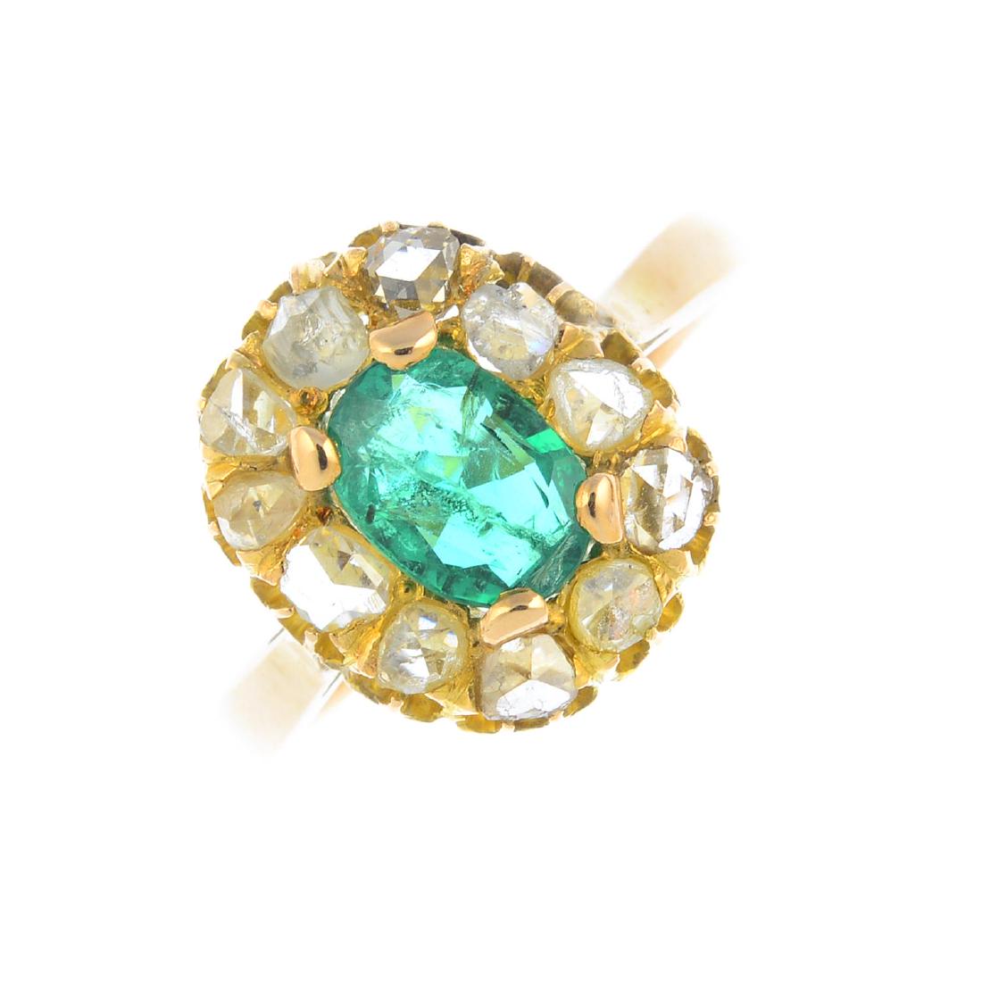 An emerald and diamond cluster ring. The oval-shape (1 of 3)