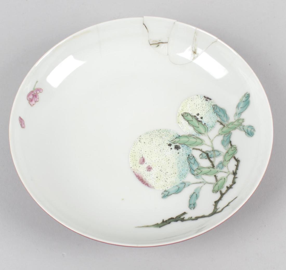 A Chinese porcelain famille rose patterned dish,: A Chinese porcelain famille rose patterned dish, printed character mark in blue to underside, (a/f), 6.25 (5.5cm) diameter.