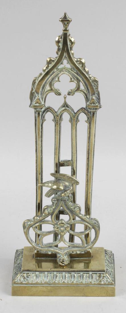 A 19th century gilt bronze letter rack of gothic: A 19th century gilt bronze letter rack of gothic design, 11.5 (29.25cm) high.