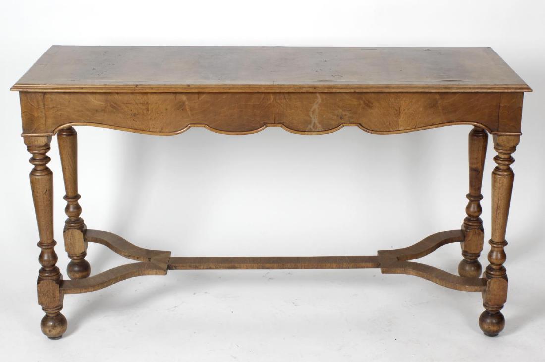 A William and Mary style walnut serving table, early: A William and Mary style walnut serving table, early 20th century, the moulded rectangular top having figural veneered panels within crossbanding, on moulded apron and four turned tapering supports wi