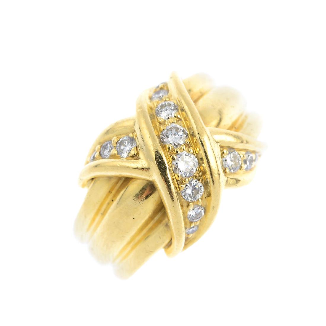 TIFFANY & CO. - a diamond 'Signature X Kiss' ring. (1 of 3)