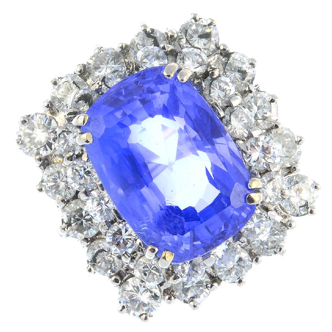 A Ceylon sapphire and diamond cluster ring. The (1 of 4)