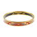 HERMÈS - an enamel bangle. With gold-tone edge, the