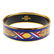 HERMÈS - an enamel bangle. The design features red,