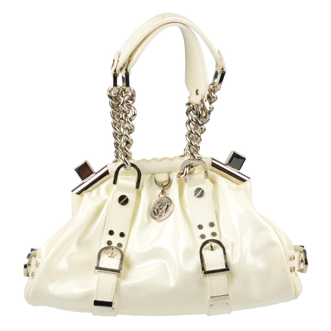 VERSACE - a frame handbag. Featuring a cream patent (1 of 4)