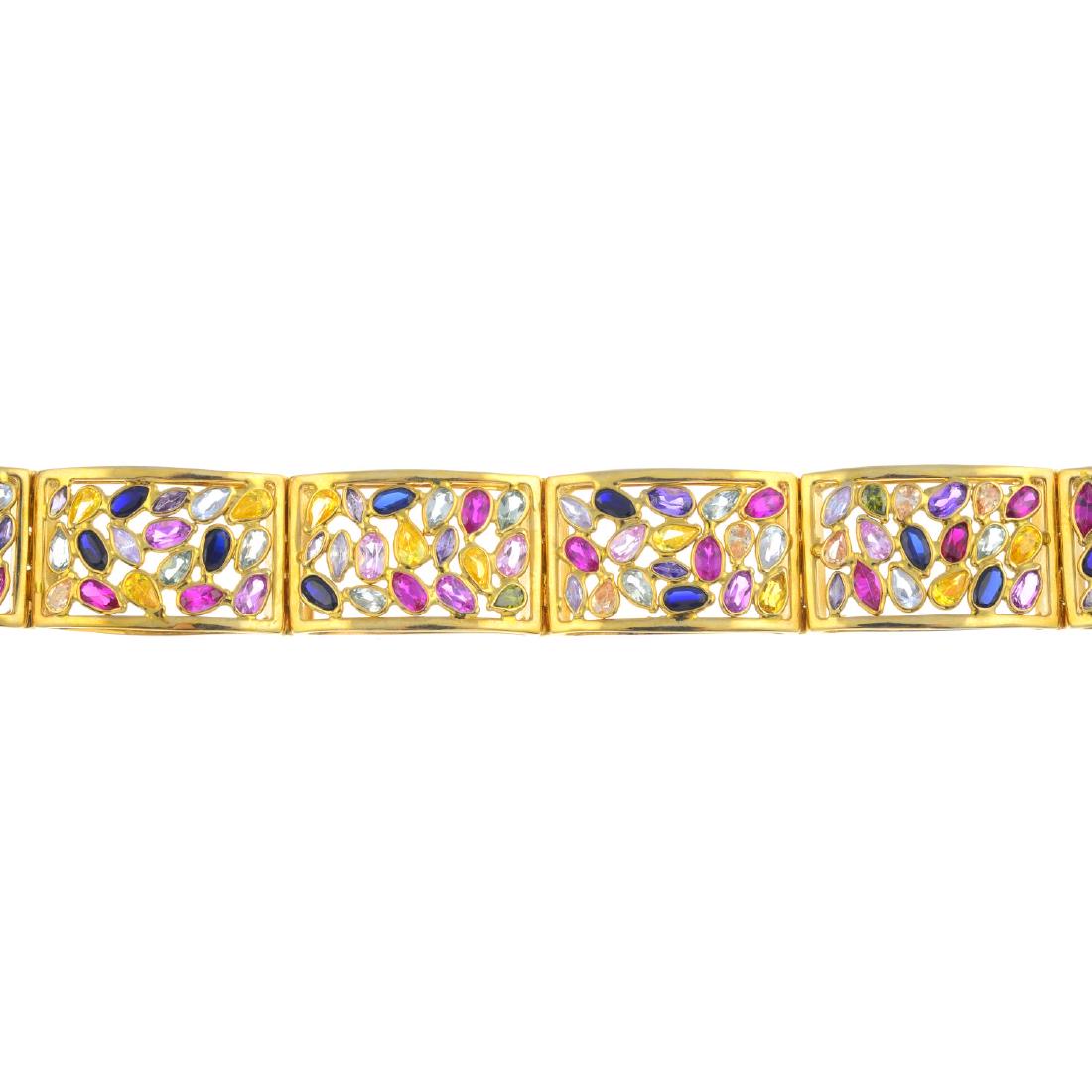 A gem-set bracelet. Comprising a series of vari-hue (1 of 2)