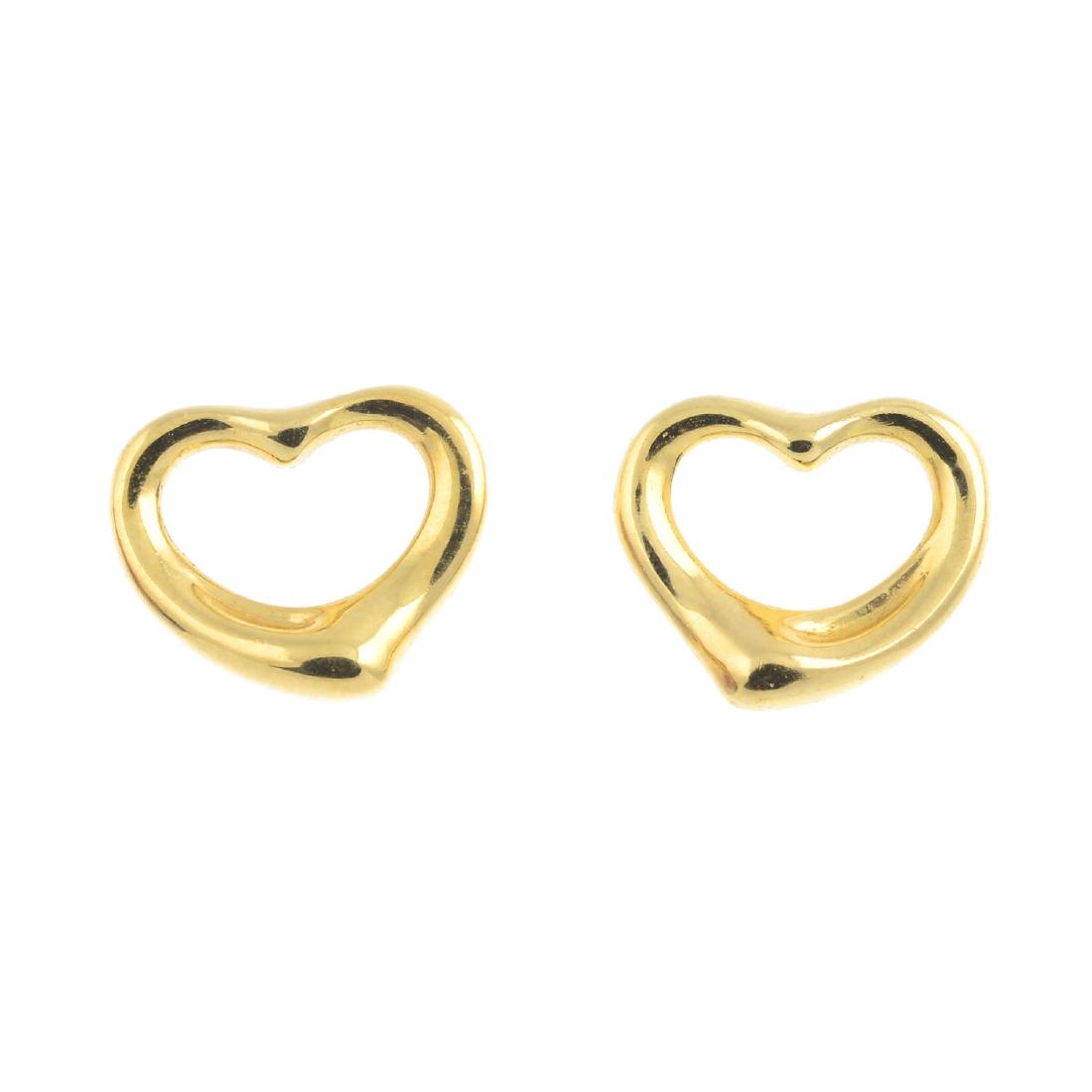TIFFANY & CO. - a pair of 'Open Heart' earrings. Each: TIFFANY & CO. - a pair of 'Open Heart' earrings. Each designed as a stylised heart. Signed Tiffany & Co., Elsa Peretti. Length 1.1cms. Weight 2.5gms.
