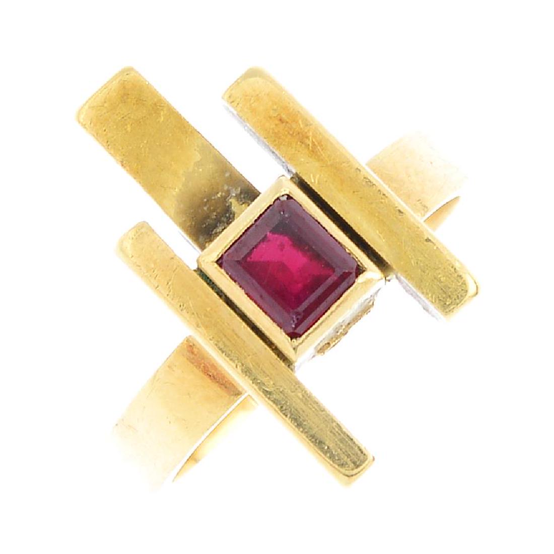 GRIMA - a 1960s 18ct gold ruby dress ring. Of abstract: GRIMA - a 1960s 18ct gold ruby dress ring. Of abstract design, the square-shape ruby collet, with bar surround, to the angular band. Signed Grima. Hallmarks for London, 1966. Approximate ring size L.