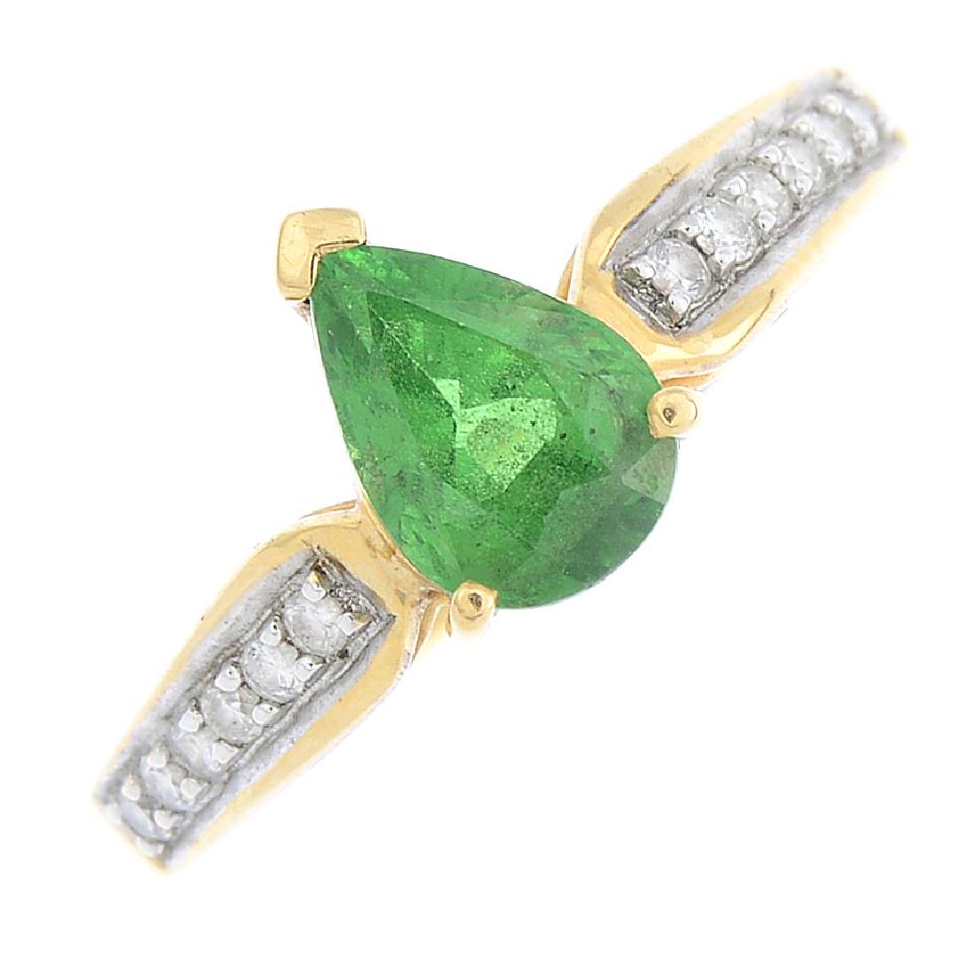 An 18ct gold tsavorite garnet and diamond ring. The (1 of 3)