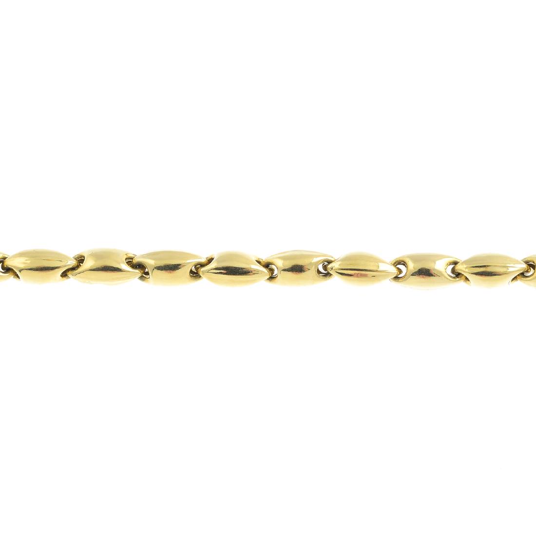 CHIMENTO - a bracelet. Designed as a series of fancy: CHIMENTO - a bracelet. Designed as a series of fancy barrel-links, with lobster clasp. Signed Chimento. Italian marks. Length 20.5cms. Weight 7.5gms.