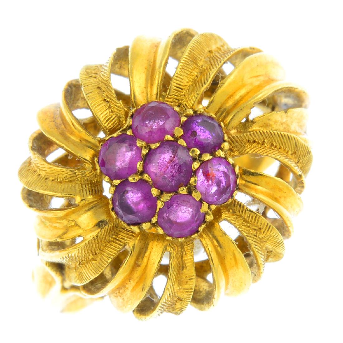 A mid 20th century ruby dress ring. Of openwork design, (1 of 3)