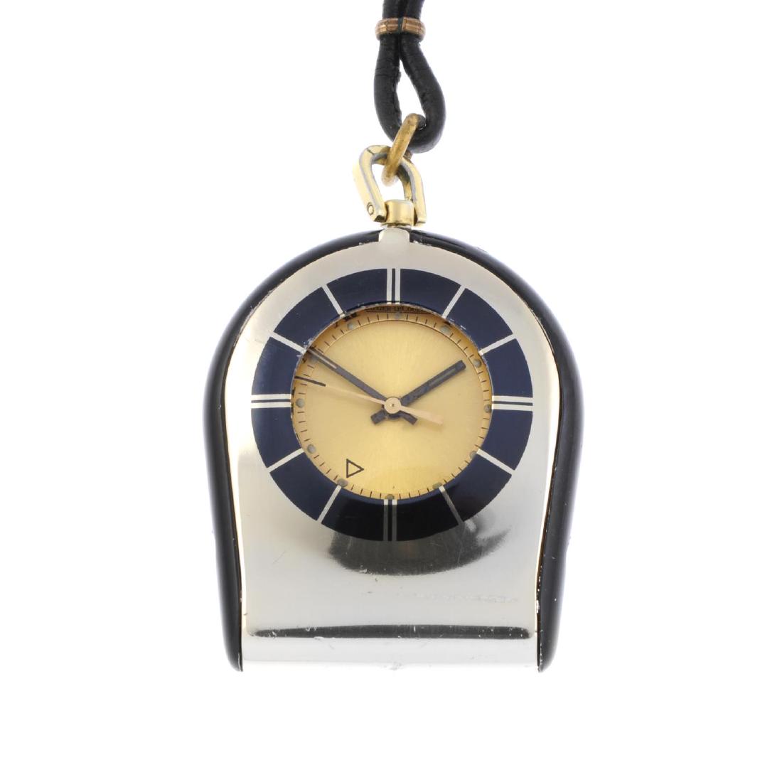 A travel alarm clock by Jaeger-LeCoultre. Bi-colour (1 of 3)