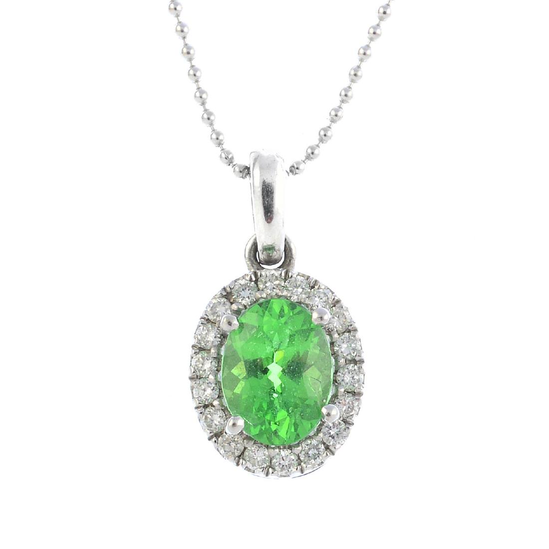 A tsavorite garnet and diamond cluster pendant. The (1 of 3)