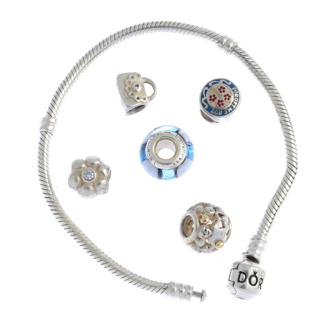 PANDORA - two charm bracelets, nine Pandora charms and: PANDORA - two charm bracelets, nine Pandora charms and four non-designer charms. The bracelets both of snake-link chain design with barrel-shape clasps, with seven Pandora charms including a heart and
