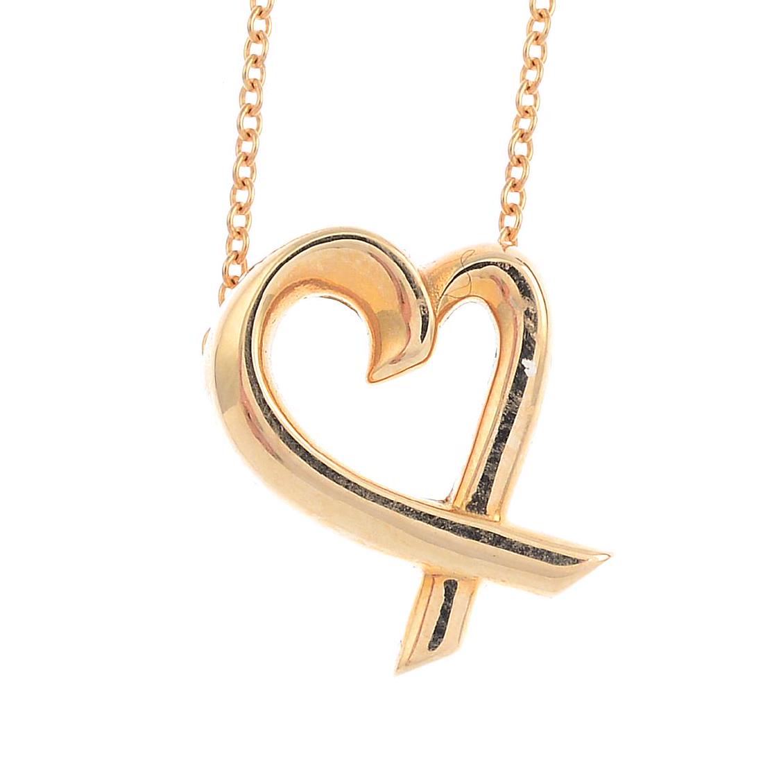 TIFFANY & CO. - a 'Loving Heart' pendant. Of openwork: TIFFANY & CO. - a 'Loving Heart' pendant. Of openwork design, the stylised crossover heart, suspended from an integral trace-link chain. Signed Tiffany & Co., Paloma Picasso. Length of pendant 1.5cms.