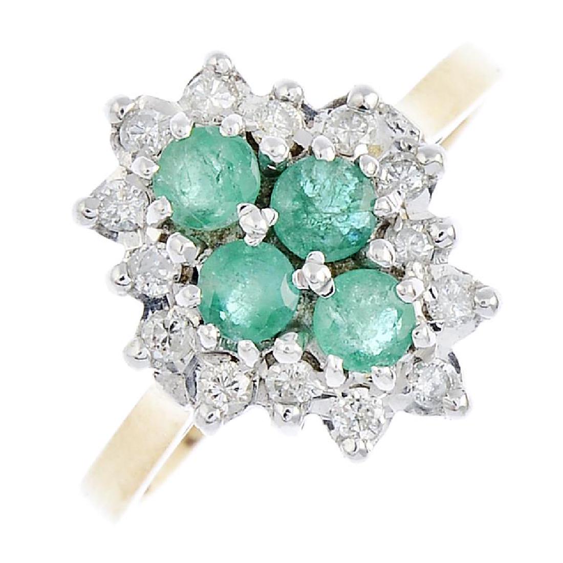 A 9ct gold diamond and emerald dress ring. The (1 of 3)