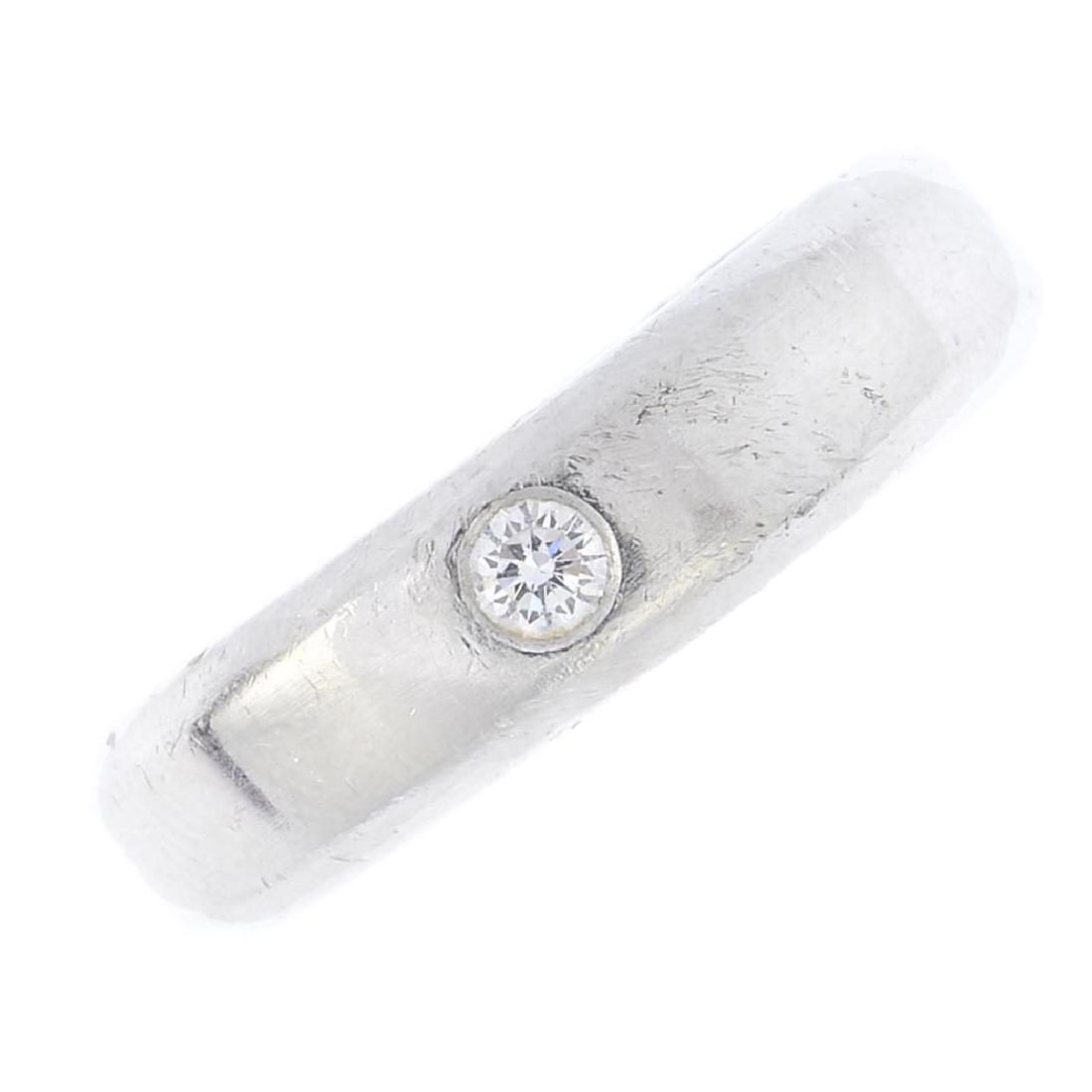 A gentleman's platinum diamond band ring. The (1 of 3)