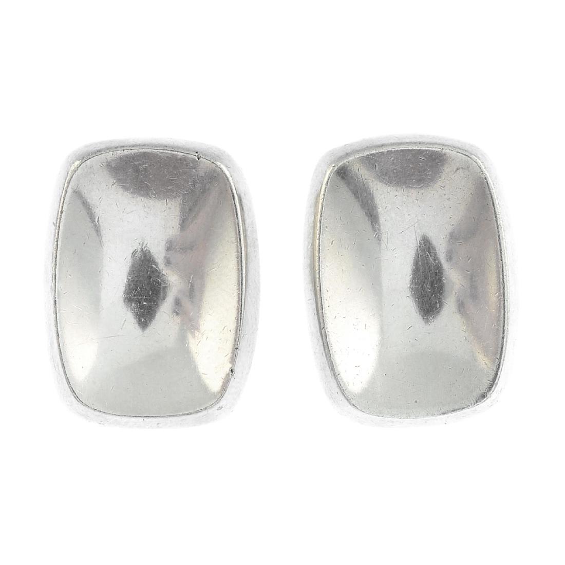 BENT KNUDSEN - a pair of 1970s silver earrings. Each: BENT KNUDSEN - a pair of 1970s silver earrings. Each comprising a curved cushion-shape panel. Maker's mark for Bent Kundsen. Import marks for London, 1972. Length 2.2cms. Weight 15.6gms.