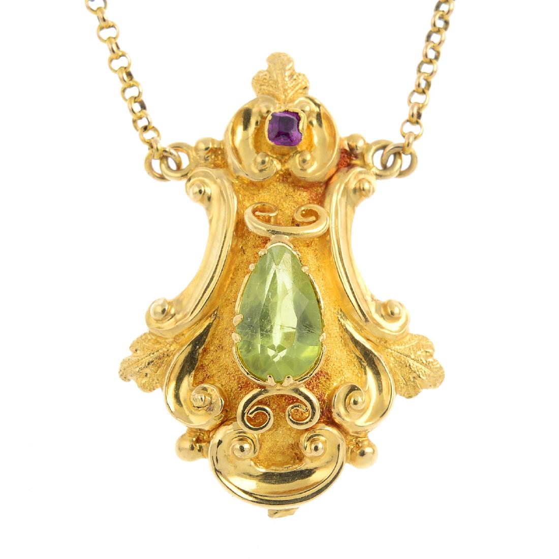 A peridot and ruby pendant. Designed as a textured (1 of 2)