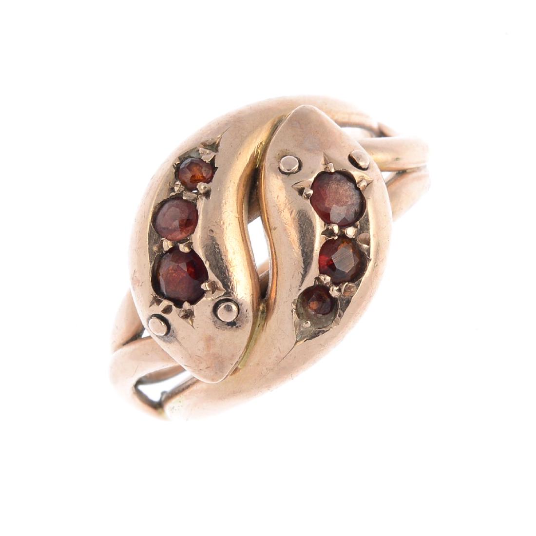 An Edwardian 9ct gold garnet snake ring. Designed as (1 of 3)